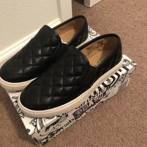 NWT quilted black slip ons